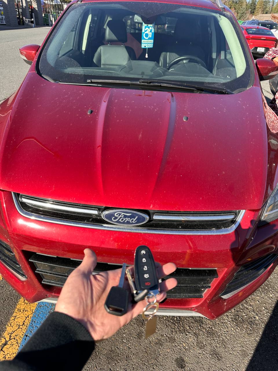 Programmed replacement key for a red Ford vehicle